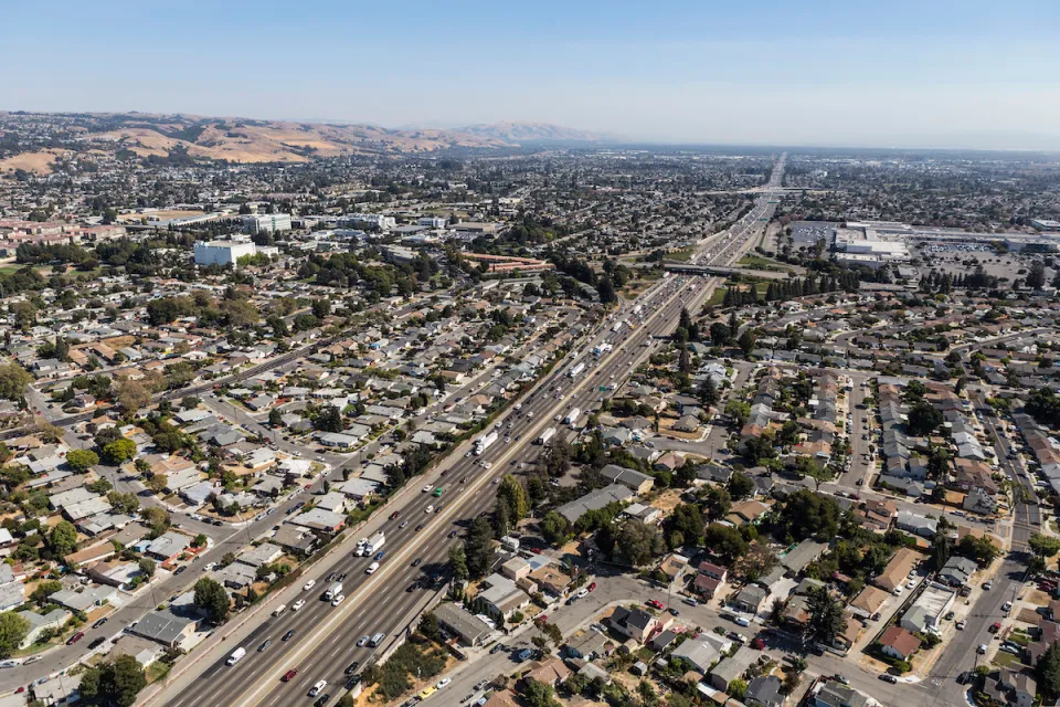 Aerial view of highway through neighborhood in Oakland, California.